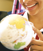 Photo of girl pointing some place on globe