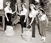 Black-and-white photo of Girl Scouts at a 1954 All-States encampment.